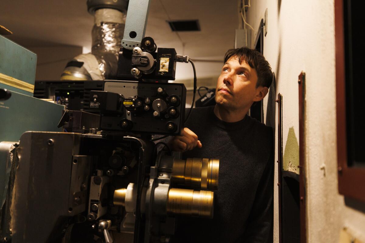 Sean Baker takes in the projection room at the Gardena Cinema.