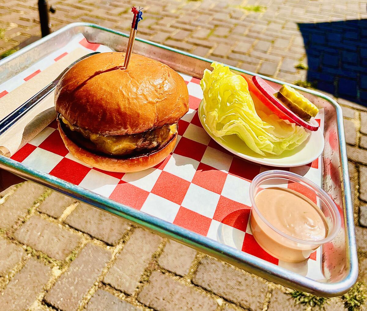 Cassell's cheeseburger with iceberg lettuce, tomato, onion, pickle and Thousand Island sauce at its Chinatown location.