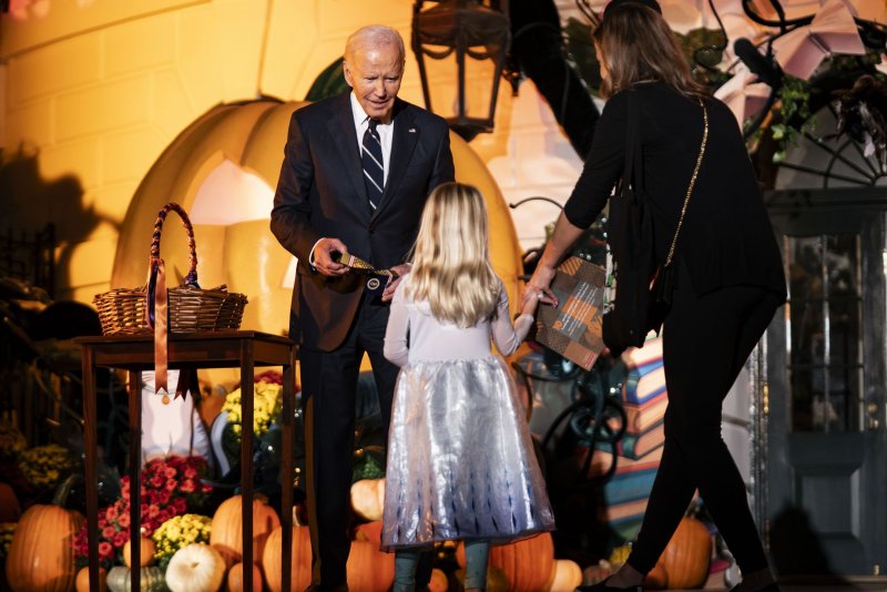 President Joe Biden hands out candy and books to trick-or-treaters during Wednesday's "Hallo-READ!" event on the South Lawn of the White House in Washington, D.C. Photo by Bonnie Cash/UPI