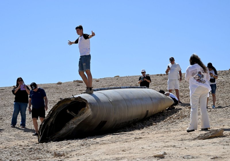 People look at the wreckage of an Iranian ballistic missile, on the first day Rosh Hashanah, the Jewish New Year, in the Negev desert near the Dead Sea, on Thursday, October 3, 2024. Two days earlier, Iran had launched some 200 ballistic missiles at Israel. File Photo by Debbie Hill/ UPI