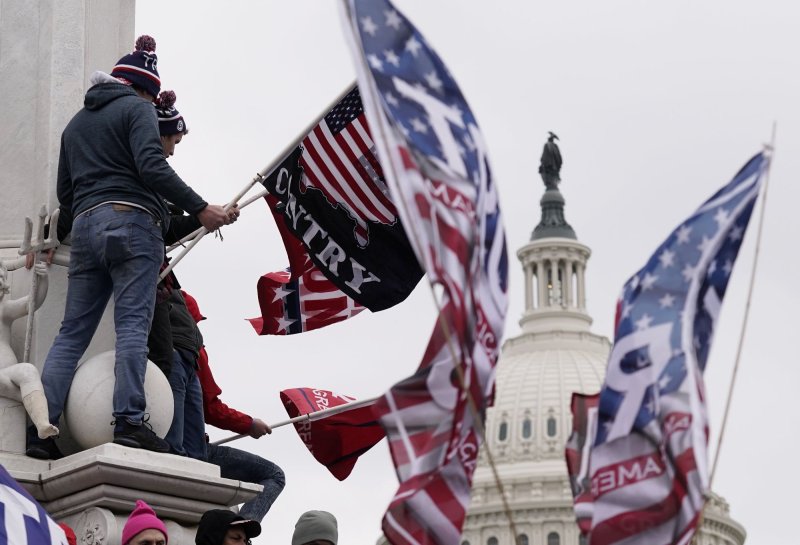 Pro-Trump supporters breach the security perimeter of the U.S. Capitol to protest against the Electoral College vote count that would certify President-elect Joe Biden as the winner in Washington, D.C. on Wednesday, January 6, 2021. Federal prosecutors have since charged some 1,500 people in connection to the attack. File Photo by Ken Cedeno/UPI