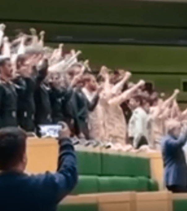 Iranian MPs can be seen chanting 'death to America' and punching the air in parliament