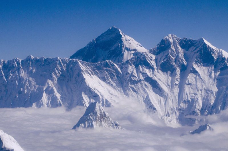 Mount Everest as seen from an aircraft over Nepal on September 14, 2013. A documentary team said it found the remains of a foot belonging to climber Andrew "Sandy" Irvine on a slope along Mount Everest, where it has been for 100 years. File Photo by Narendra Shrestha/EPA-EFE