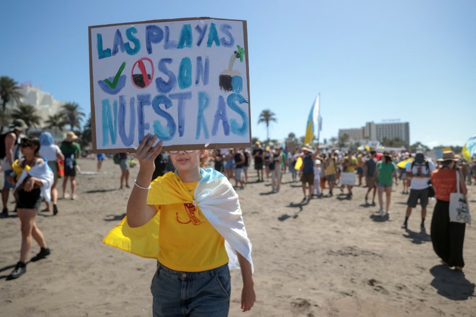 Thousands of demonstrators swarmed resorts on the Canary Islands on Sunday