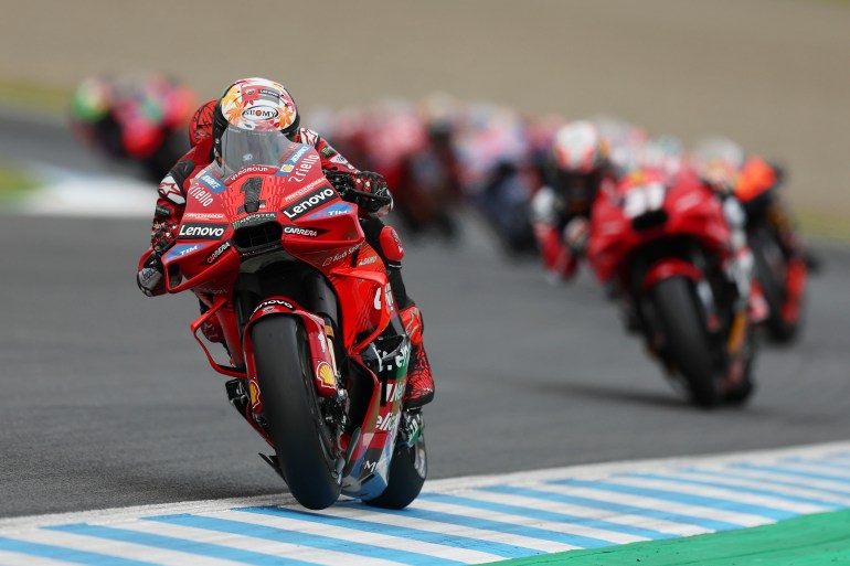 MotoGP rider leads the field on the opening lap of race in Japan.