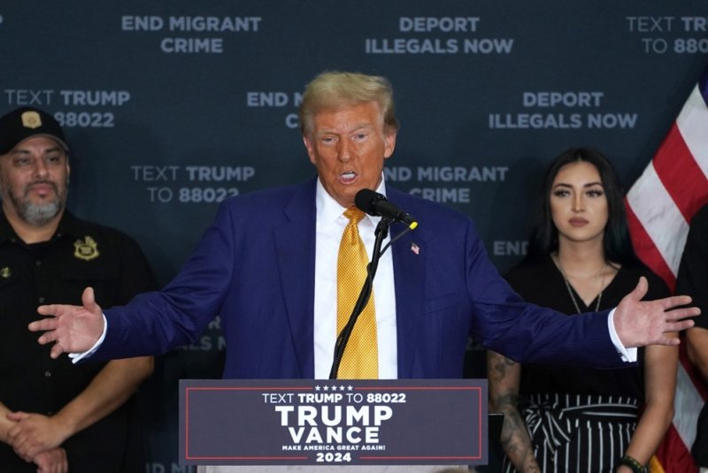 Republican presidential candidate Donald Trump speaks to the press at Austin-Bergstrom International Airport in Austin on Friday. He appeared Saturday in suburban Detroit seeking to woo Muslim-American voters living in the hotly contested battleground state. Photo by Dustin Safranek/EPA-EFE