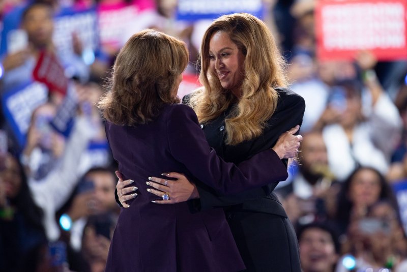 Vice President and Democratic presidential nominee Kamala Harris (L) embraces singer Beyonce during a campaign rally Friday at the Shell Energy Stadium in Houston. Photo by Carlos Ramirez/EPA-EFE