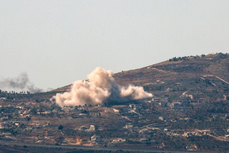 Smoke rises from explosions in the southern Lebanese village of Odessa as Israel Defense Forces strike Hezbollah positions after approximately 180 projectiles fired by Hezbollah crossed from Lebanon into Israel, including three that targeted Israeli Prime Minister Benjamin Netanyahu's home in Caesarea. Photo by Atef Safadi/EPA-EFE