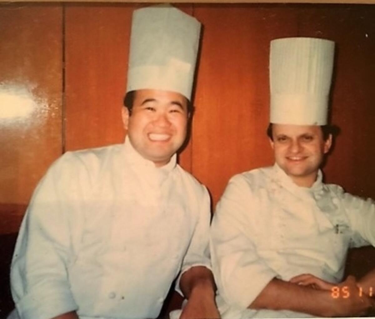 Chef Akira Hirose, left, with French chef Joël Robuchon in 1985.