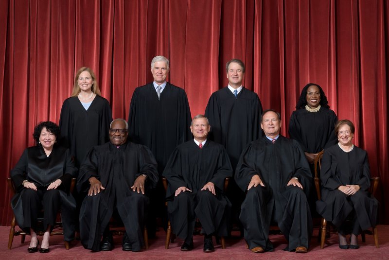 Supreme Court justices, who have begun their new term. are: Seated from left are Justices Sonia Sotomayor, Clarence Thomas, Chief Justice John G. Roberts Jr. and Justices Samuel A. Alito and Elena Kagan. Standing from left are Justices Amy Coney Barrett, Neil M. Gorsuch, Brett M. Kavanaugh and Ketanji Brown Jackson. Photo by Fred Schilling, Collection of the Supreme Court of the United States / UPI