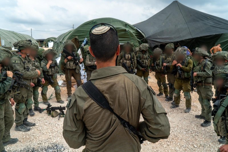 Photo provided by the Israel Defense Forces shows Israeli soldiers preparing to enter southern Lebanon. Photo by the Israel Defense Forces