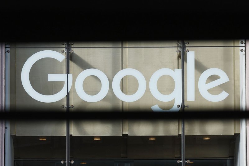 The Google brand logo hangs above the entrance to the Google Building on January 20, 2023, in New York City. Google was one of the 60 tech companies and groups that signed on to a letter asking Congress to establish an artificial intelligence safety institute. File Photo by John Angelillo/UPI