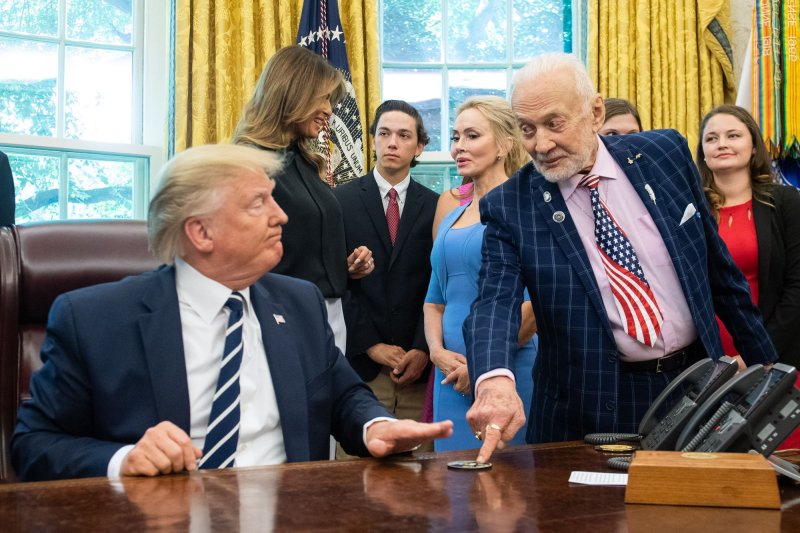 President Donald Trump talks to Apollo 11 astronaut Buzz Aldrin in the Oval Office of the White House in July 2019. On Wednesday, the former president received Aldrin's endorsement for president. File Photo by Kevin Dietsch/UPI