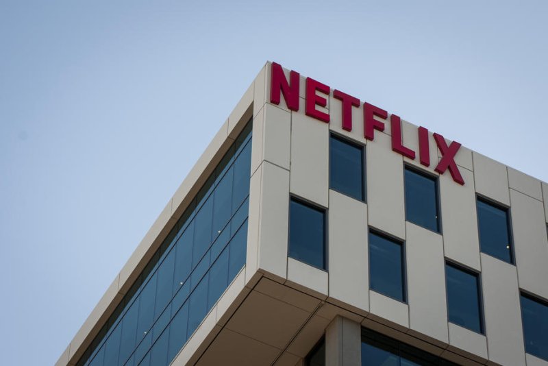 Netflix shares rose 11% Friday on third quarter financial results that beat expectations. Netflix with ads membership jumped 35% compared to the second quarter 2024. Revenue was $9.83 billion, compared with expectations of $9.77 billion. File Photo by Christian Monterrosa/ EPA-EFE