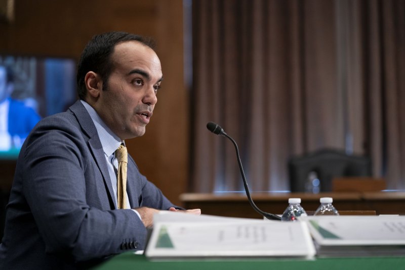 Consumer Financial Protection Bureau director Rohit Chopra speaks during a Senate Banking, Housing and Urban Affairs hearing at the U.S. Capitol on November 30, 2023. He helped announce a new rule on Tuesday. File Photo by Bonnie Cash/UPI