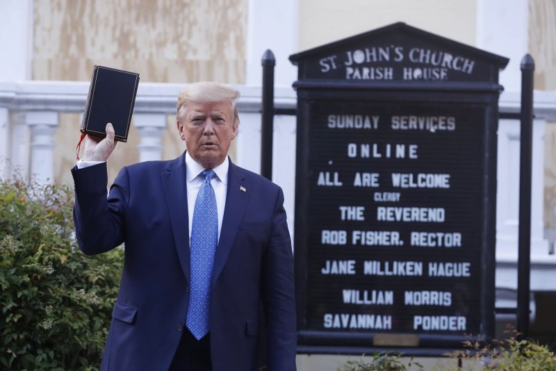 President Donald J. Trump poses with a Bible outside St. John's Episcopal Church after delivering remarks in the Rose Garden at the White House on June 1, 2020. Oklahoma changed rules on purchasing Bibles after complains grew that it supported Bibles supported by the ex-president. File Photo by Shawn Thew/UPI