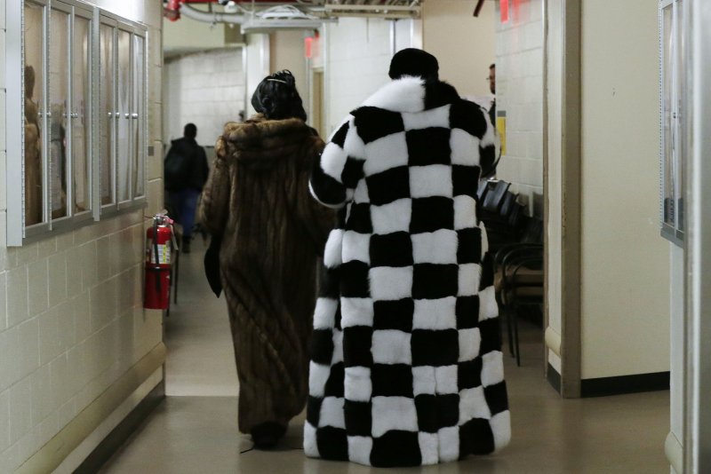 Two attendees wear fur coats as they enter the 143rd Annual Westminster Kennel Club Dog Show at Madison Square Garden in New York City on February 12, 2019. On October 12, 2019, California became the first state in the United States to ban the sale of new fur products. File Photo by John Angelillo/UPI