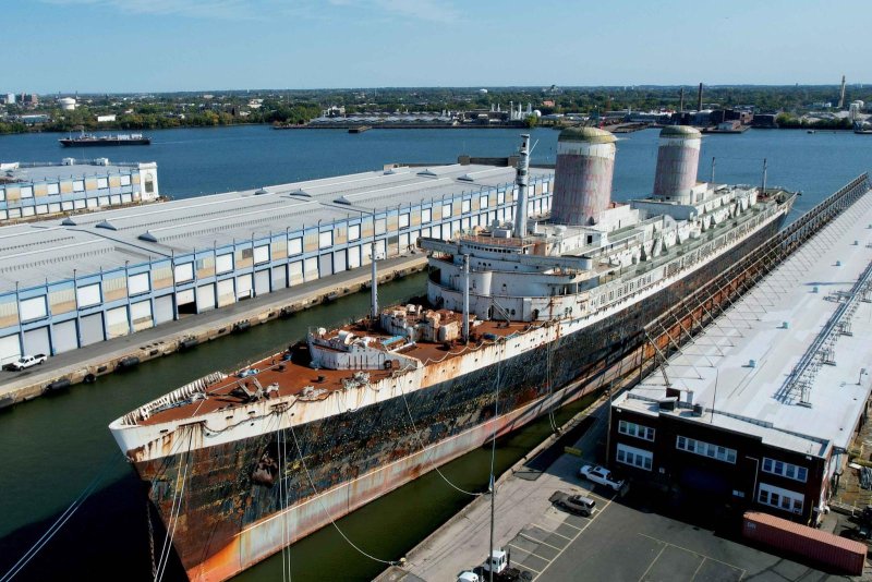 The SS United States is shown at dock in Philadelphia during a ceremony a week ago in which title to the vessel was transferred to Okaloosa County, Fla. The county plans to convert the former cruise liner into the world's largest artificial reef to benefit its tourism and fishing industries. Photo courtesy of the Okaloosa County Board of Commissioners/Facebook