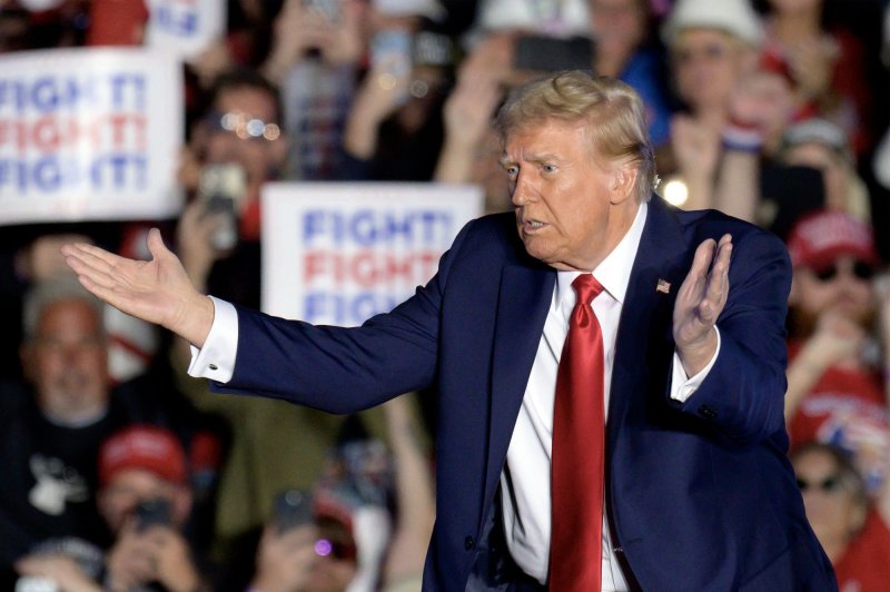 Former President Donald Trump waves to the crowd near the end of his rally at the Butler Farm Show grounds on October 5 in Butler, Pennsylvania. Photo by Archie Carpenter/UPI