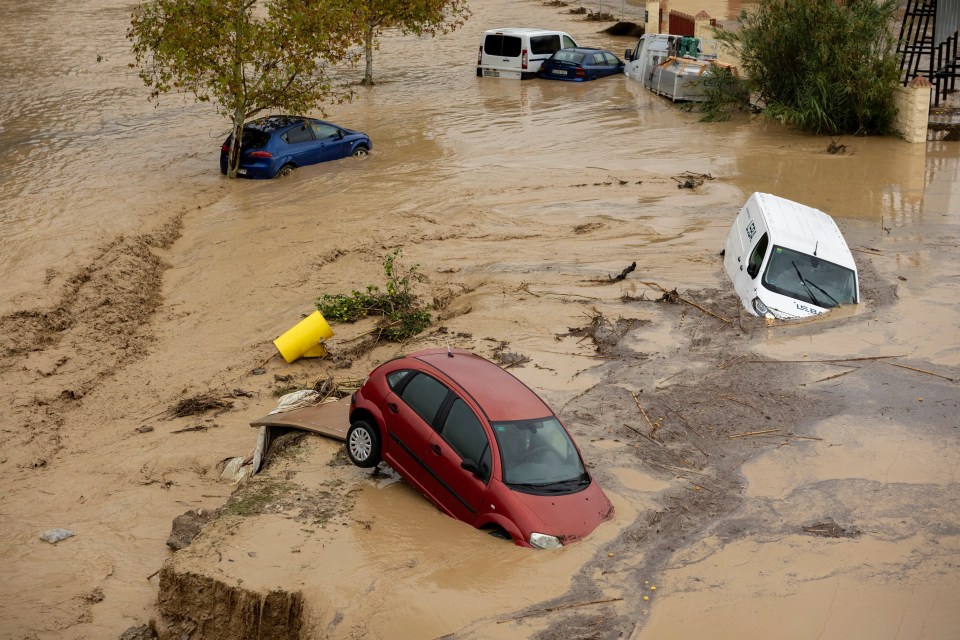 Partially submerged vehicles in Malaga