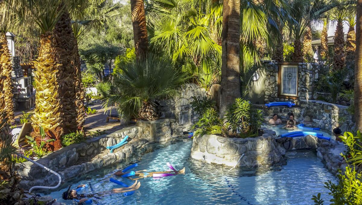 Two Bunch Palms' Mineral Springs grotto surrounded by palm trees