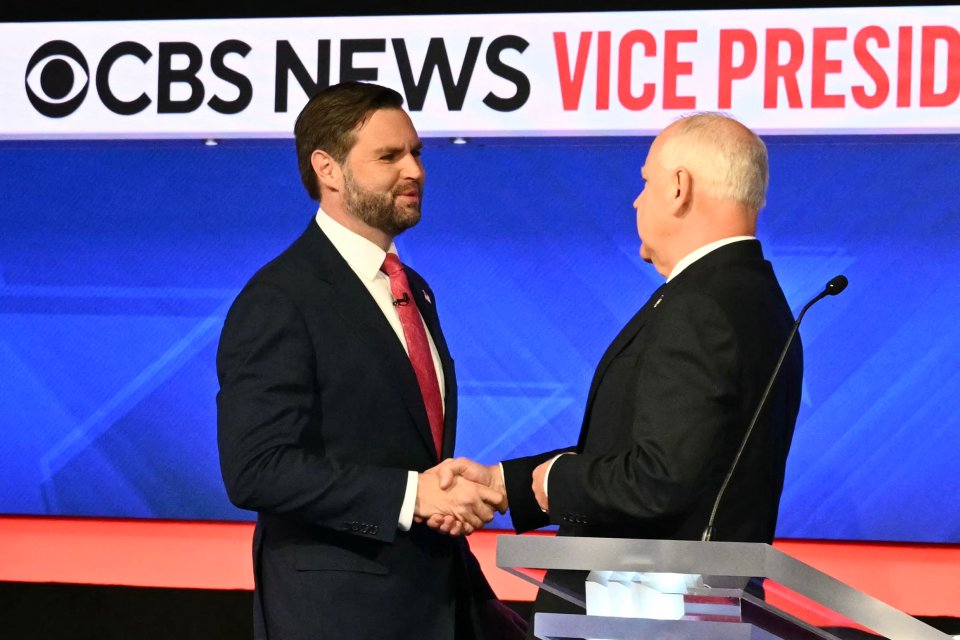 J.D. Vance and Tim Walz shake hands ahead of the vice-presidential debate