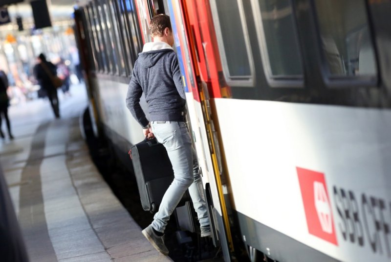 A man is seen boarding a train at the central railway station of Hamburg, Germany in May 2015. Two people suspected of having the potentially lethal Marburg virus who traveled on a train at the station have tested negative, according to a Thursday statement from the city of Hamburg's social welfare office. File Photo by Bodo Marks/EPA