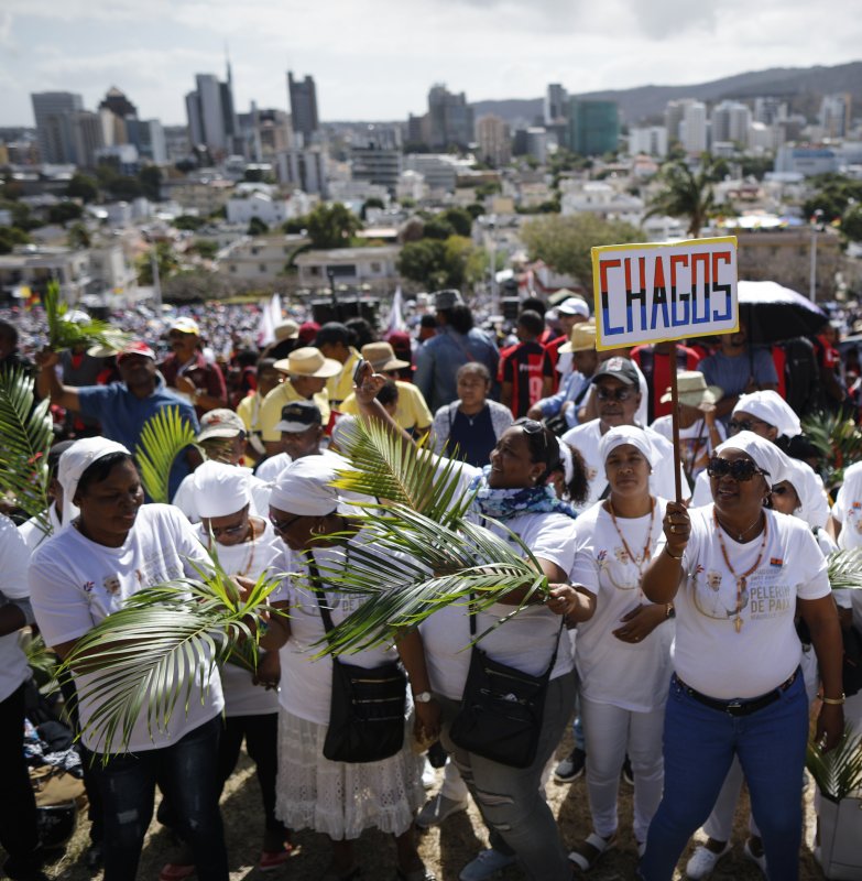 A group of Chagossians demand a return to their former home of Diego Garcia as they attend a mass hosted by Pope Francis in Port Louis, Mauritius, on Sept. 9, 2019. Under an agreement announced Thursday, the United Kingdom will cede its Chargos Archipelago colony to Mauritius but retain control of Diego Garcia, home to a vital British-U.S. naval base in the Indian Ocean. File Photo by Dai Kurokawa/EPA-EFE