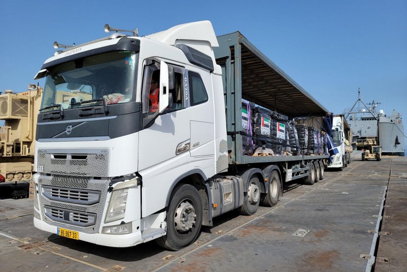 Trucks loaded with humanitarian aid provided by the U.S. Agency for International Development and the United Arab Emirates cross into Gaza in May. The U.S wrote Israel on Sunday saying the amount of aid being delivered has since dropped by more than 50%, reaching its lowest level in a year in September, and demanding Israel take steps to redress the situation. File Photo via U.S. Army/UPI