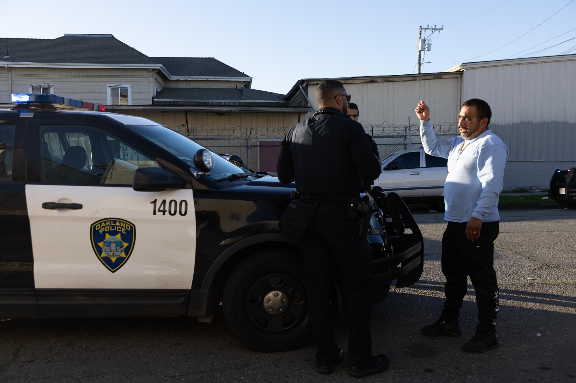 A resident tells an Oakland police officer that he was sprayed by Mace on the city's International Boulevard.