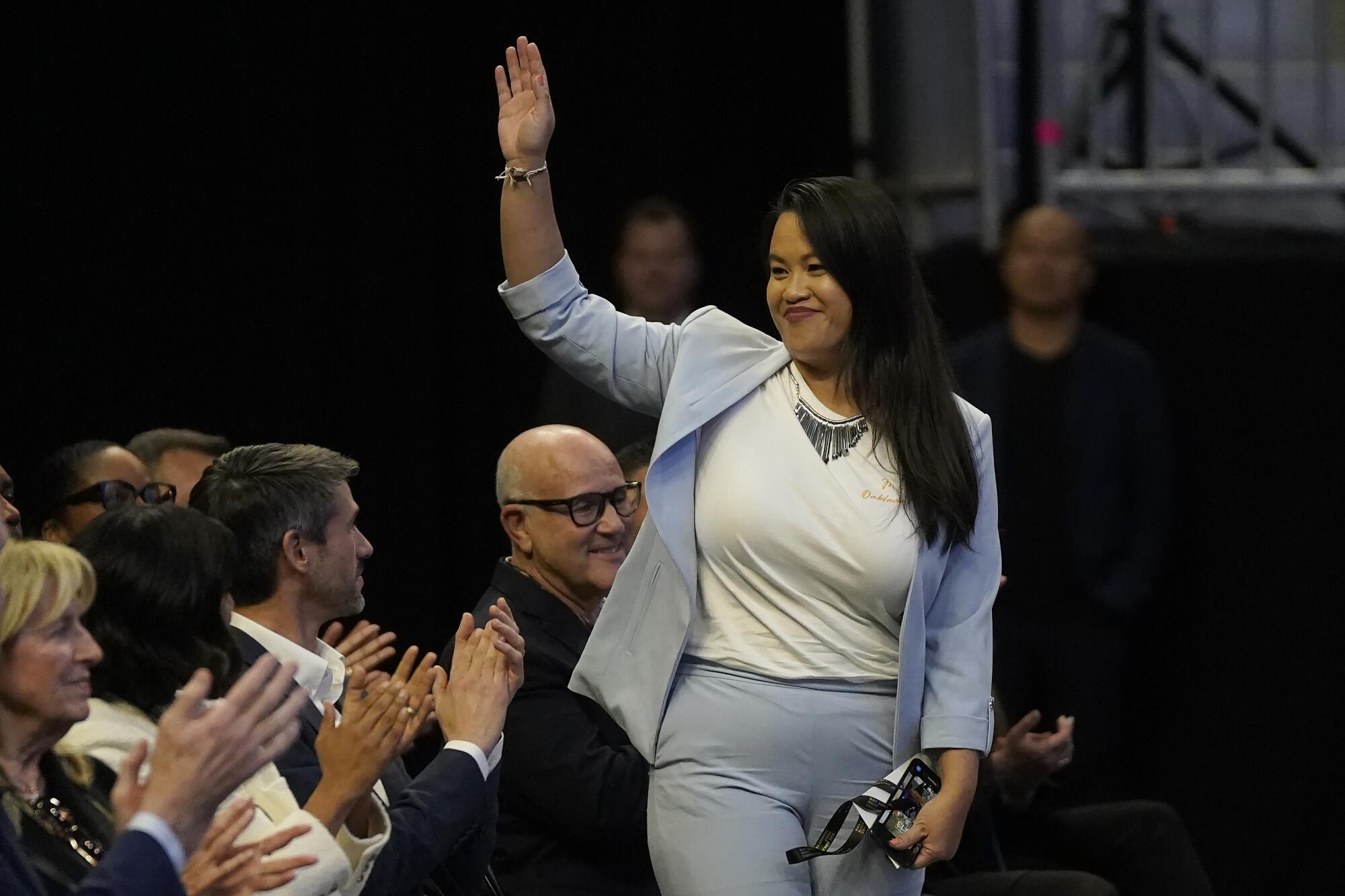 Oakland Mayor Sheng Thao waves at a 2023 news conference 