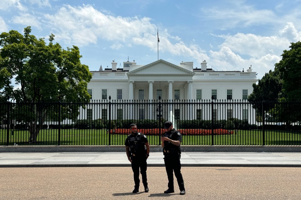 Agents from the Secret Service guard the White House