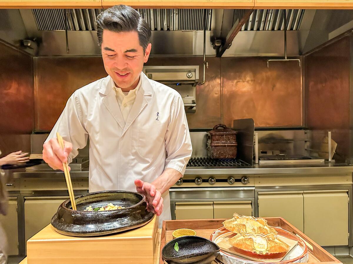 Brandon Go prepares a final course of rice and Dungeness crab at Hayato.