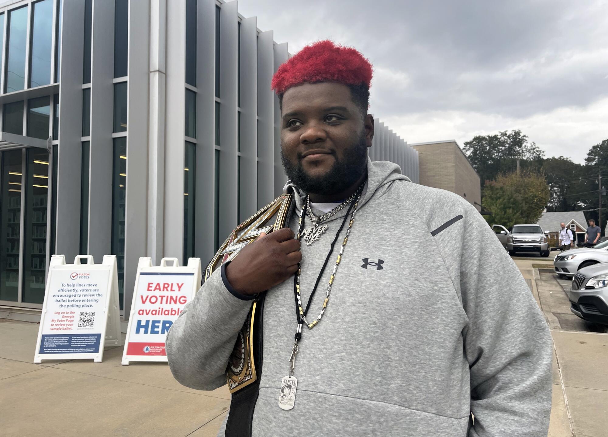 Teddy Woodson standing outside a voting center