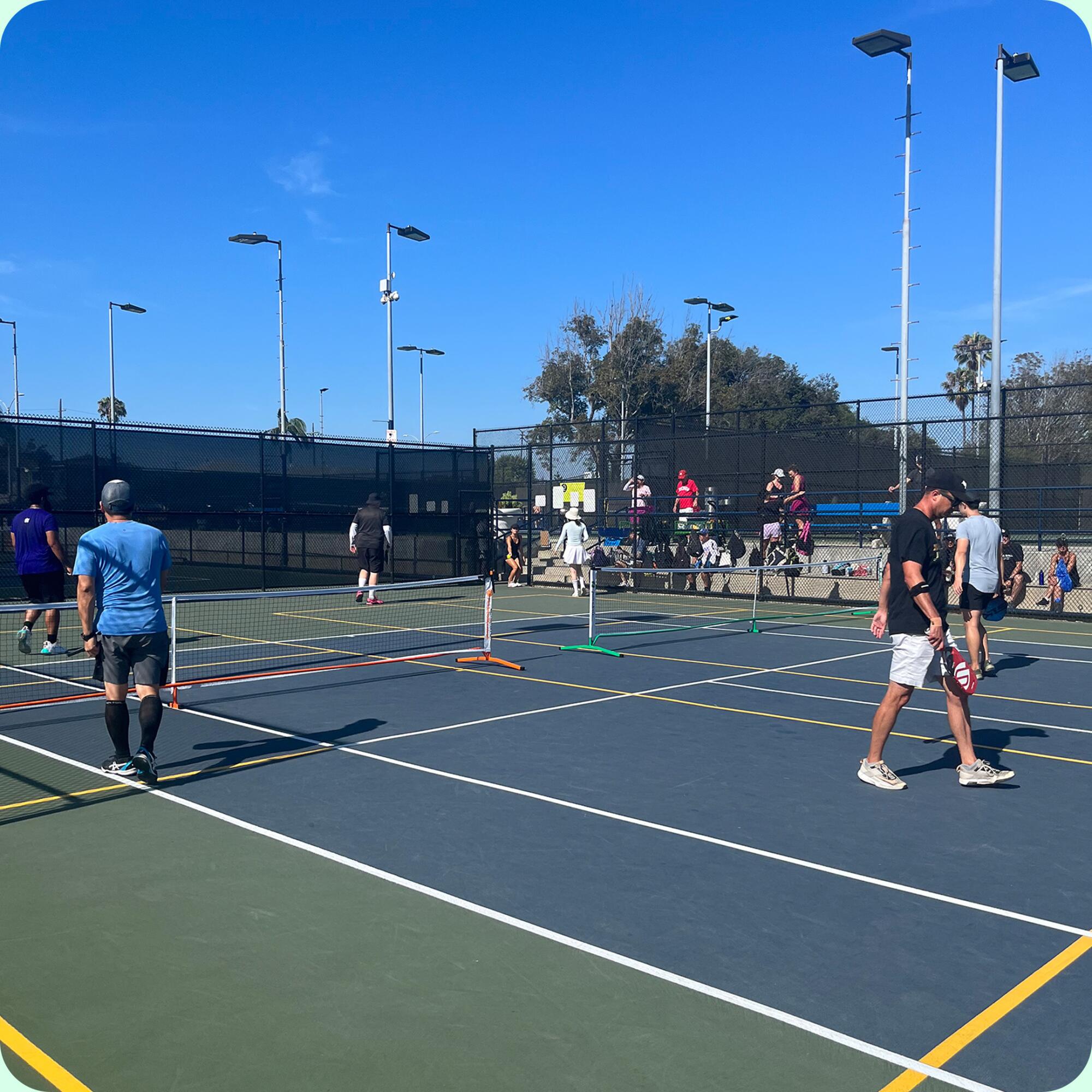 People playing pickleball on a Westchester Pickleball Club court.