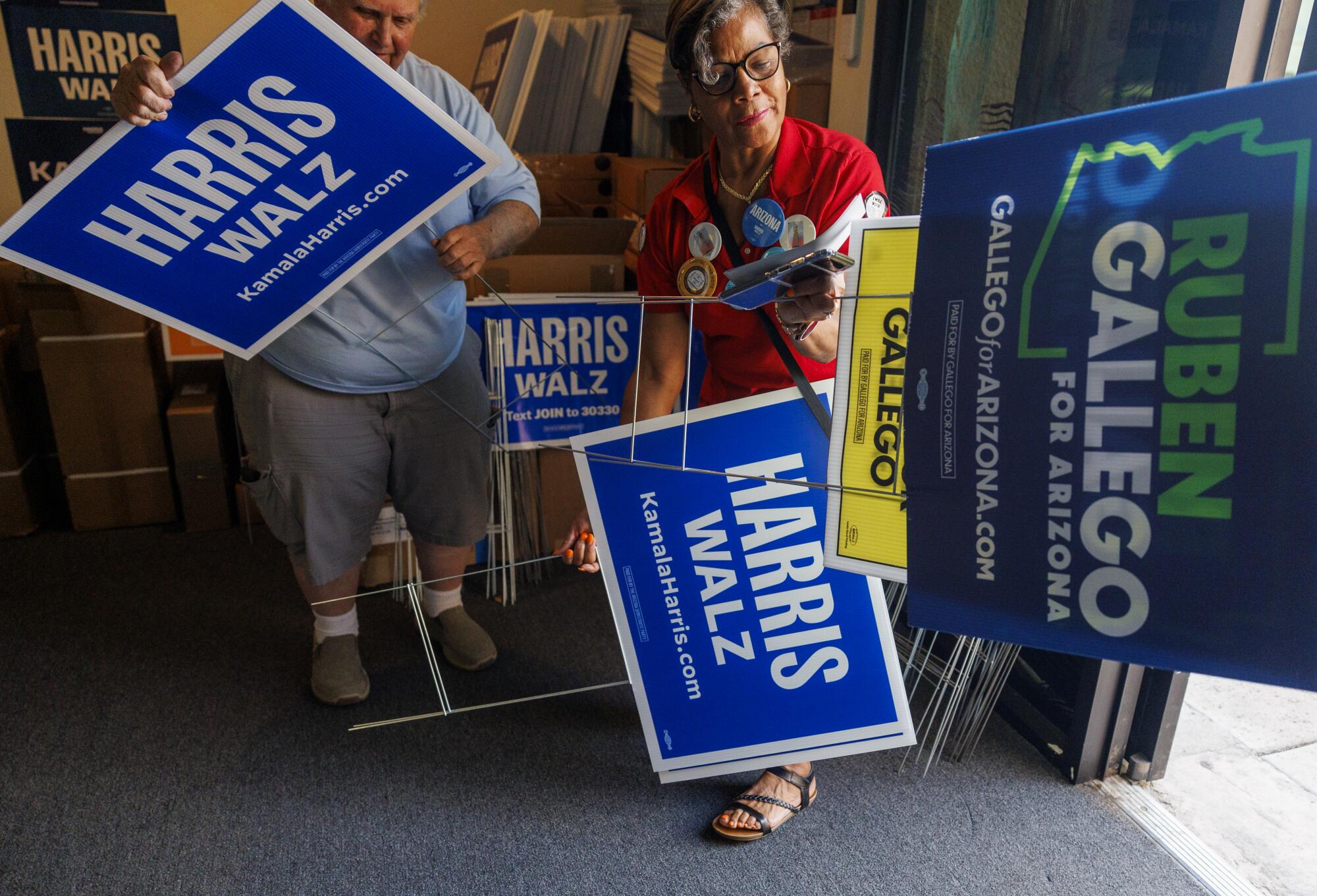  Campaign workers with candidate signs