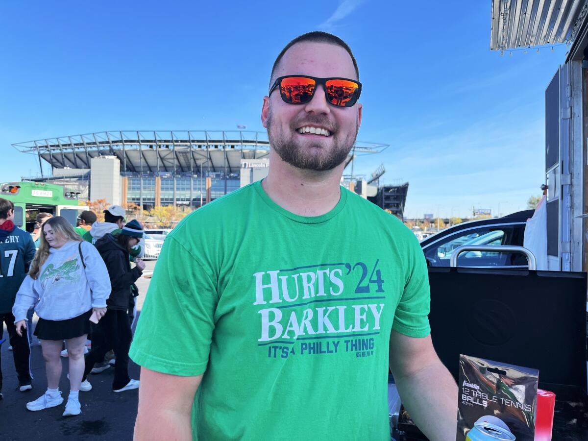 Tim Biegalski, 26, wearing a green shirt that reads "Hurts/Barkley '24" 