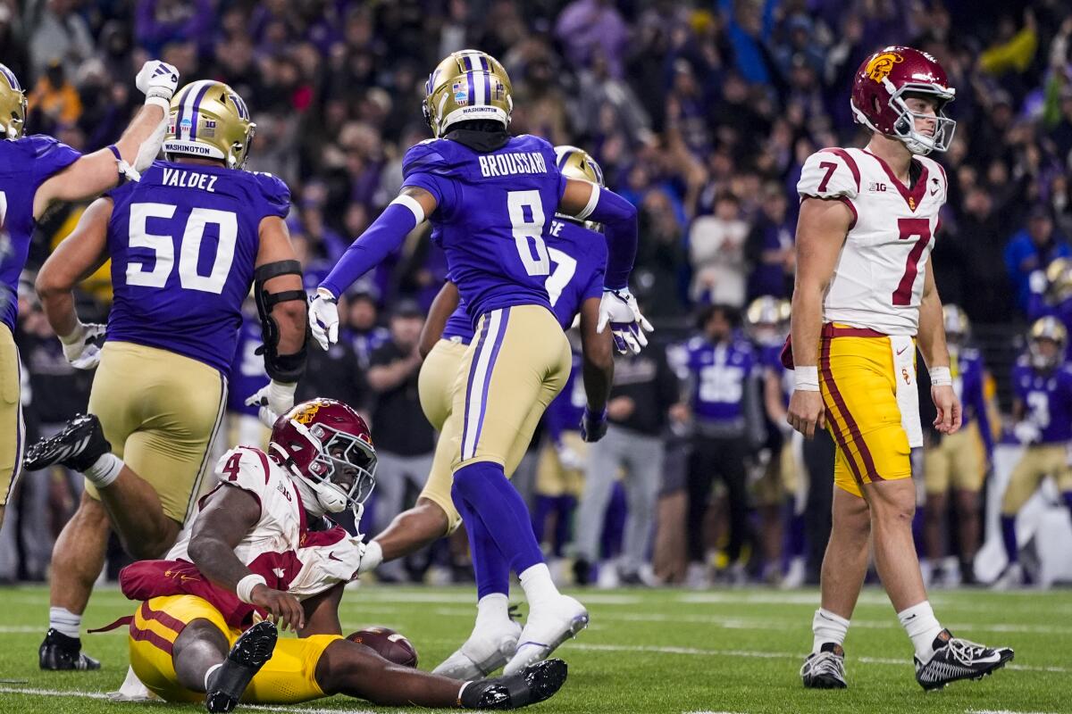 Woody Marks looks toward Miller Moss after getting stopped.