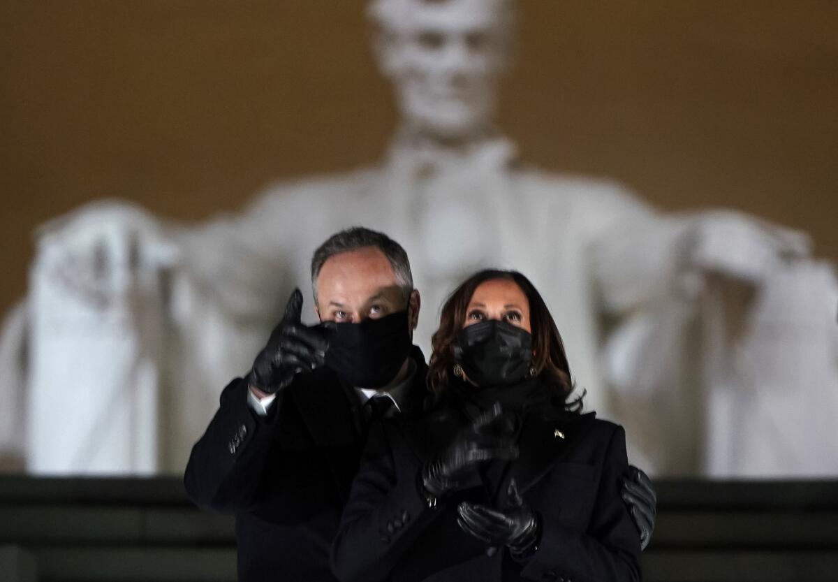 Vice President Kamala Harris and her husband, Doug Emhoff, watch fireworks at the Lincoln Memorial in Washington, D.C.