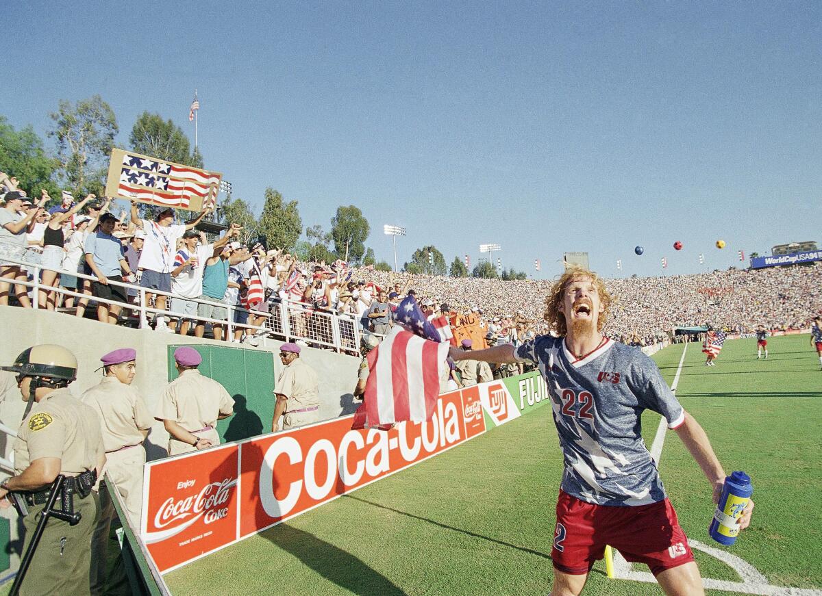 Alexi Lalas celebrates with fans after the United States defeated Colombia in a World Cup group game in 1994.