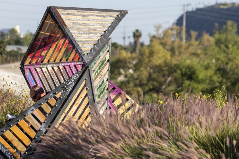 LOS ANGELES, CA - APRIL 17, 2019 - Bowtie Parcel walk along the Los Angeles River. This walk doesnt fall into the category of bucolic country stroll, but it is an unusual and unique opportunity to get outside in the middle of the urban sprawl. A little gritty and not for those who demand beautiful scenery on their walks, this is still a great leg-stretcher in a fascinating environment. Best to do this one in good shoes, as there is a fair amount of broken glass and industrial detritus underfoot. (Ricardo DeAratanha / Los Angeles Times)