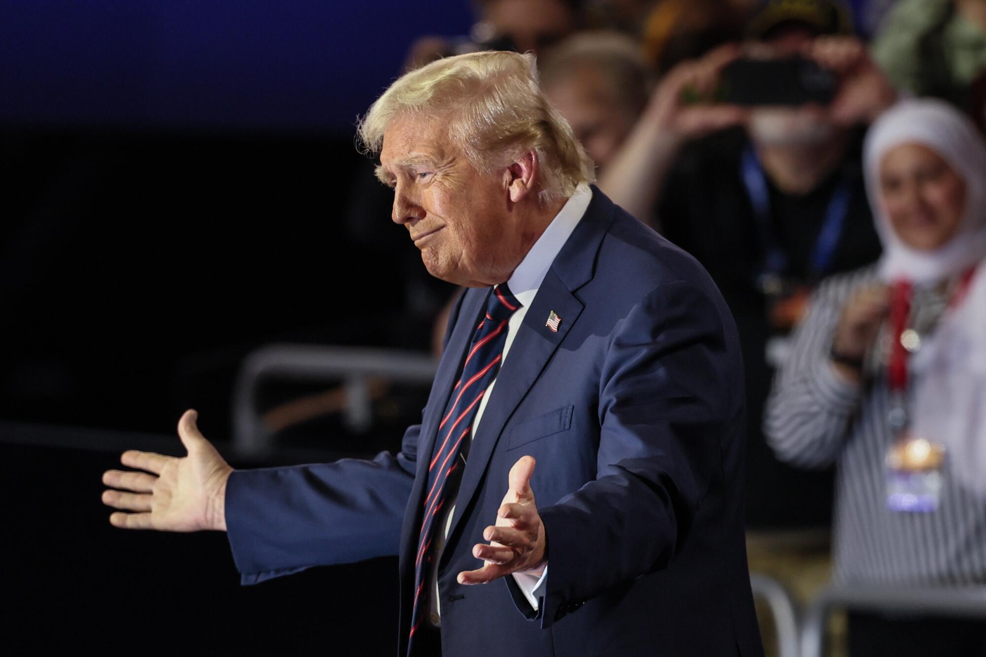 Donald Trump gestures to a crowd