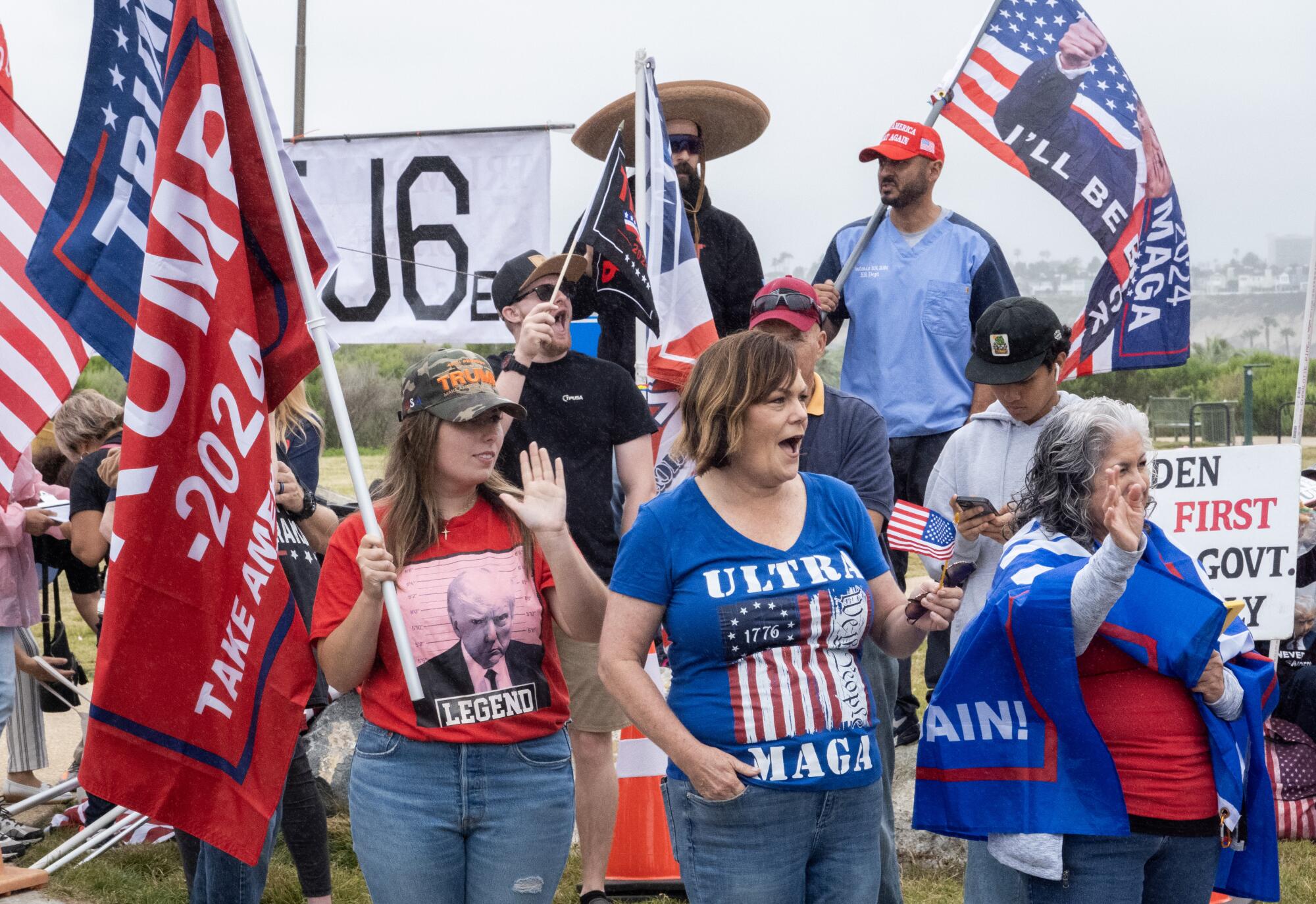 Trump supporters wait by a roadside