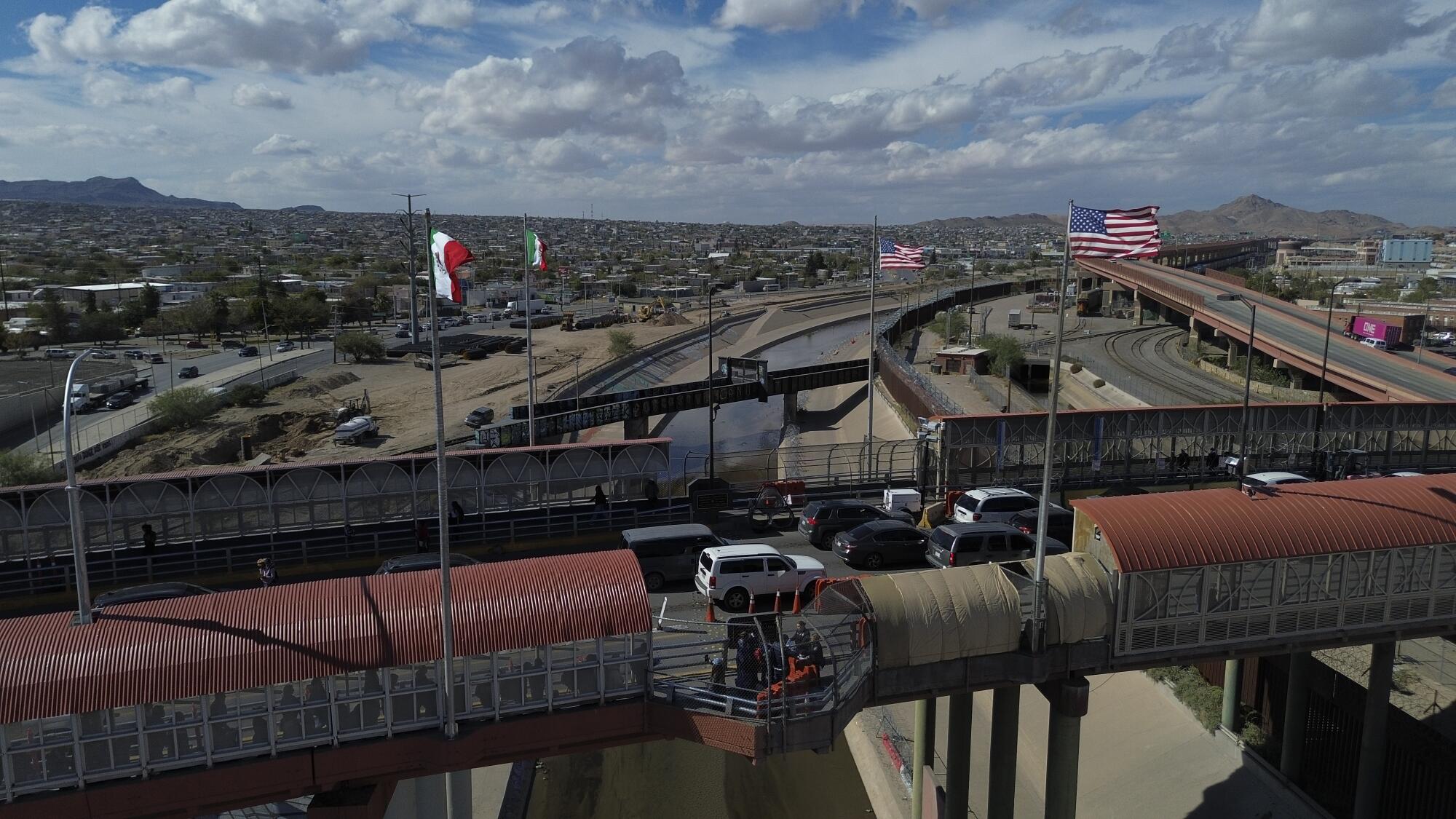 Cars cross the Paso del Norte international bridge at the U.S.-Mexico border.