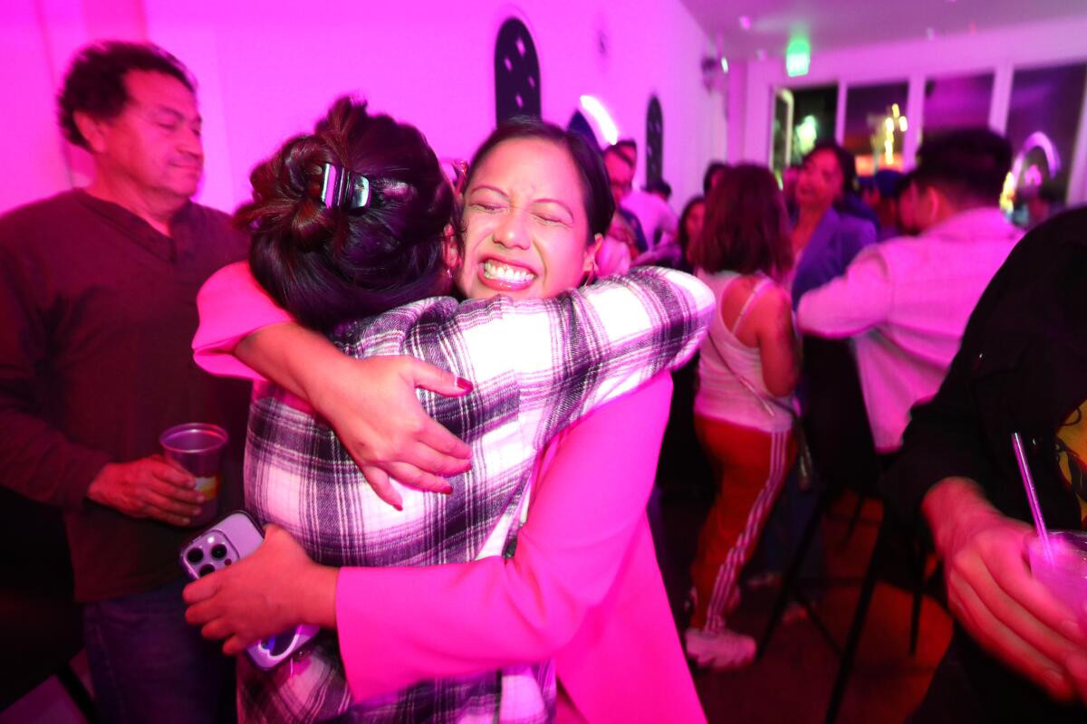 Ysabel Jurado receives a hug from a supporter 