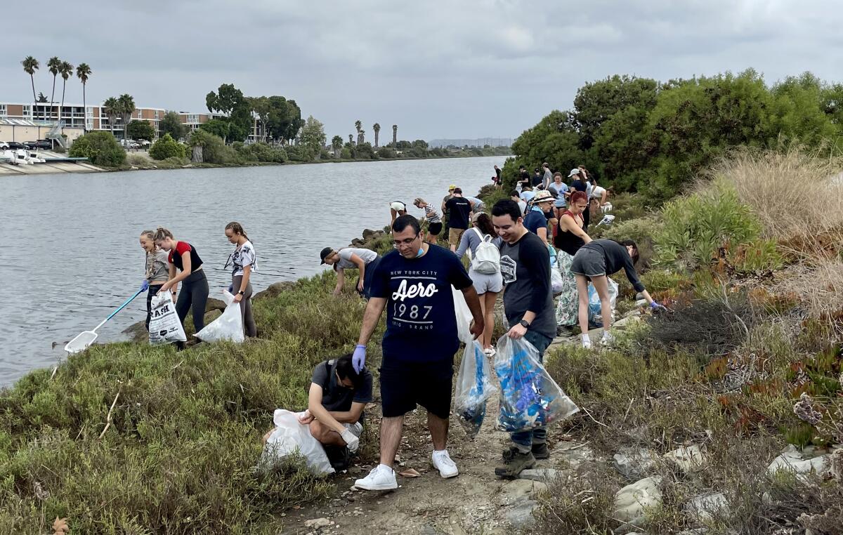 Volunteers clean up Ballona Creek, where nearly 130 square miles of Los Angeles’ storm drains empty into.