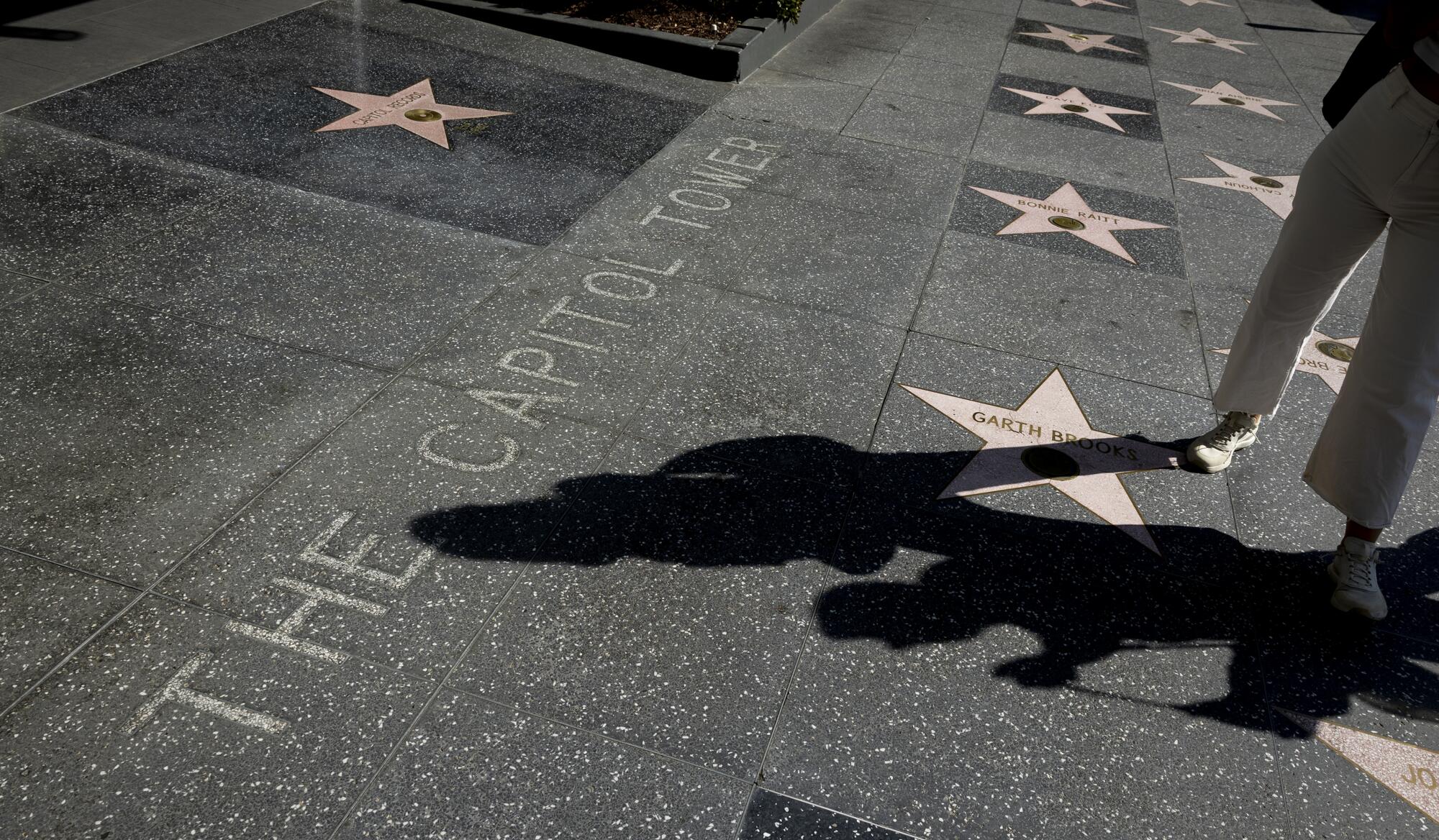 Tourists checking out the stars on the Hollywood Walk of Fame