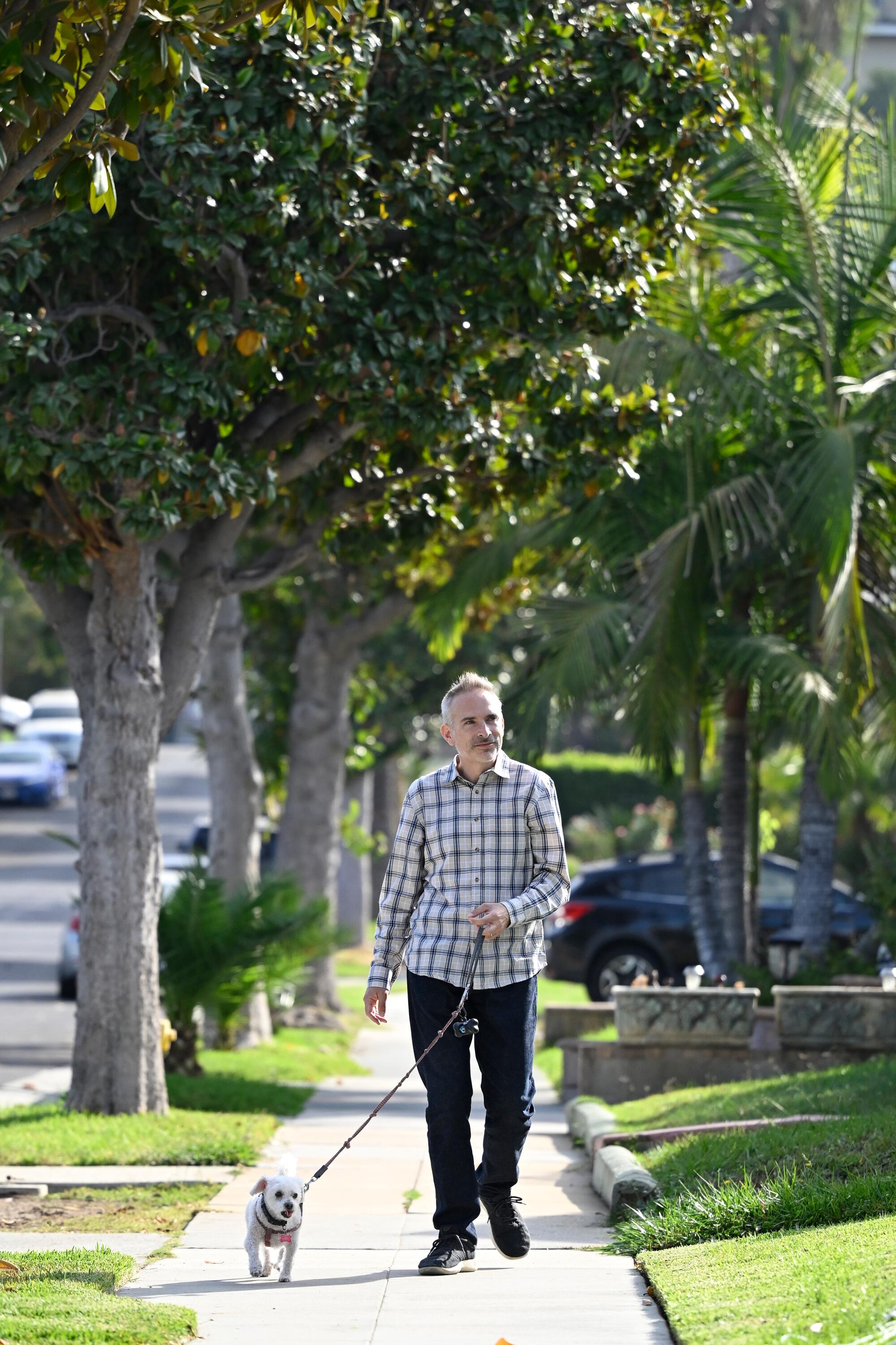 Michael Schneider with his dog, Jacks. Schneider founded the Great Los Angeles Walk in 2006.