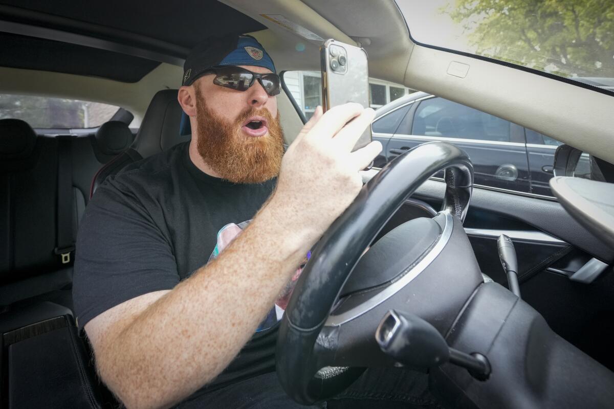 Brent Terhune channels Alpha Male in a video rant in his car in Greenwood, IN. (Photo by AJ Mast/For the LA Times)