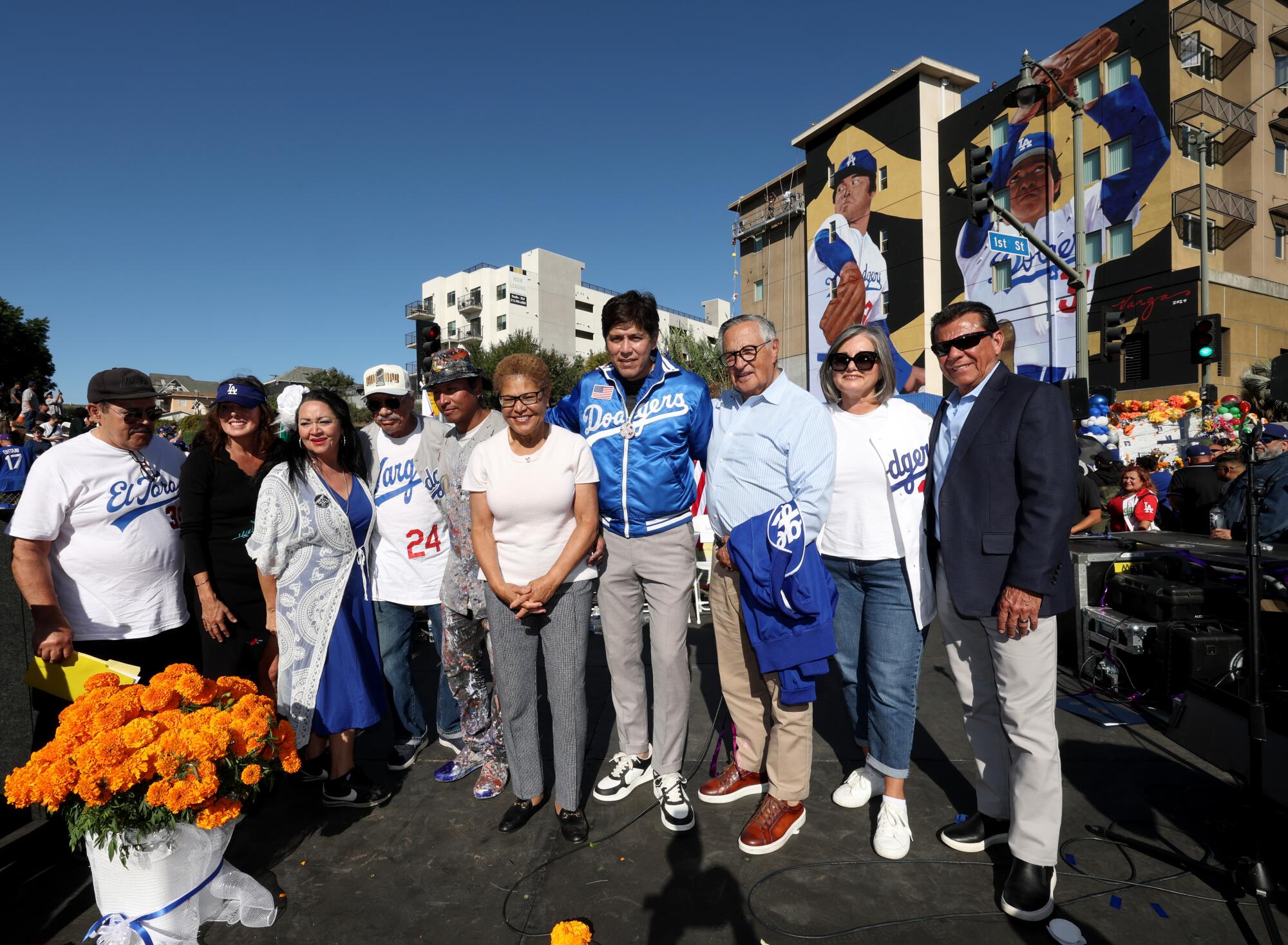 Mayor of L.A., Karen Bass, councilmember Kevin de Leon and artist Robert Vargas and others pose at unveiling ceremony 